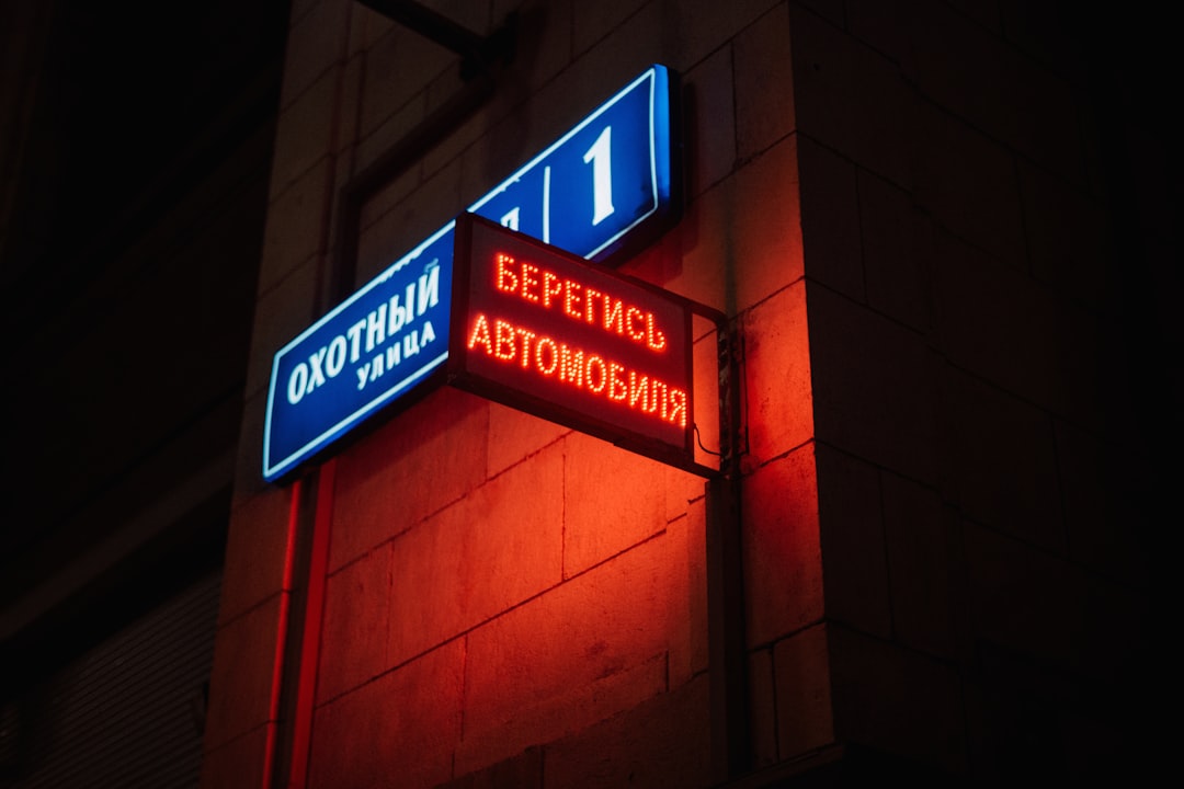 a couple of signs that are on the side of a building
