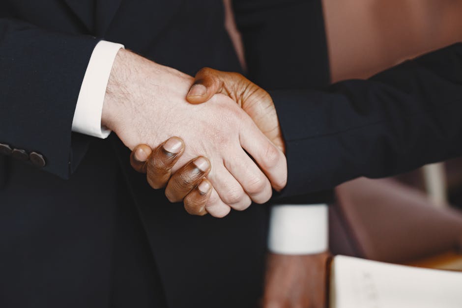 Close-up of a professional handshake symbolizing partnership and agreement.