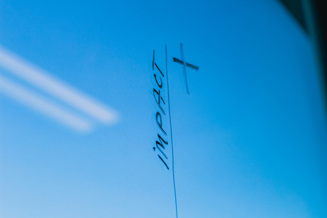 The word impact written on a blue background